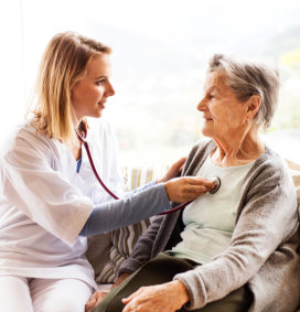 a caregiver woman taking care of an elderly woman